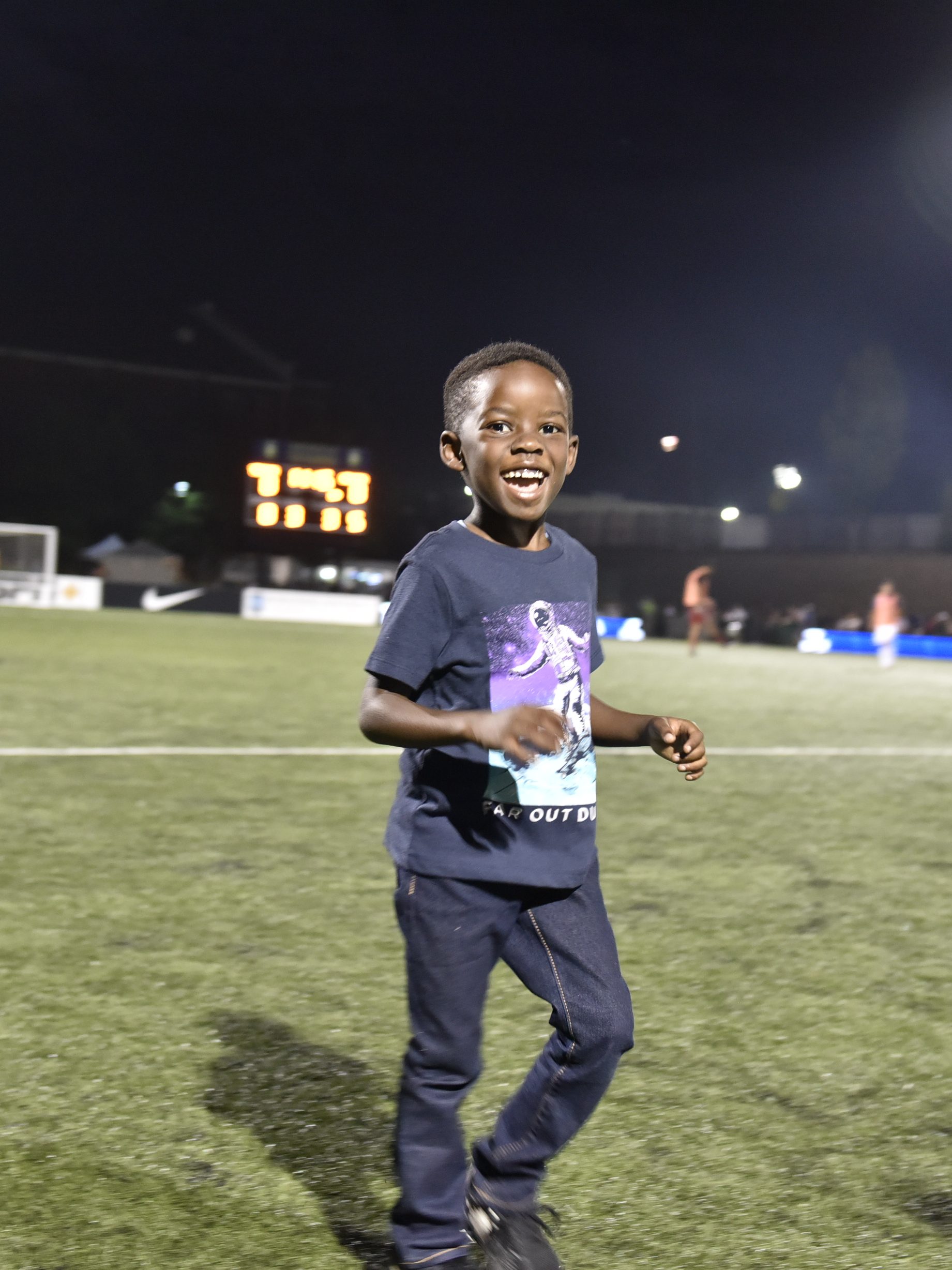 A student participates in the Read To Score match day parade. 