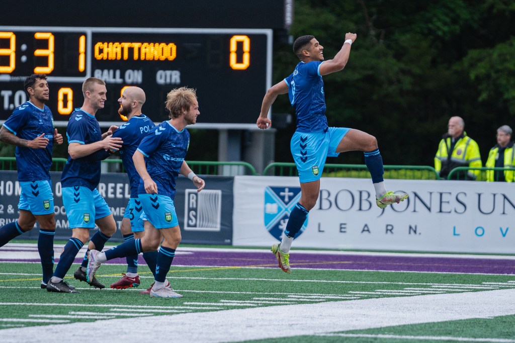 Lyam MacKinnon celebrates after his four-goal match against Chattanooga.